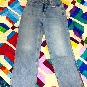 Pacsun jeans!! Flare out at the base with a slit at the bottom. Originally $60